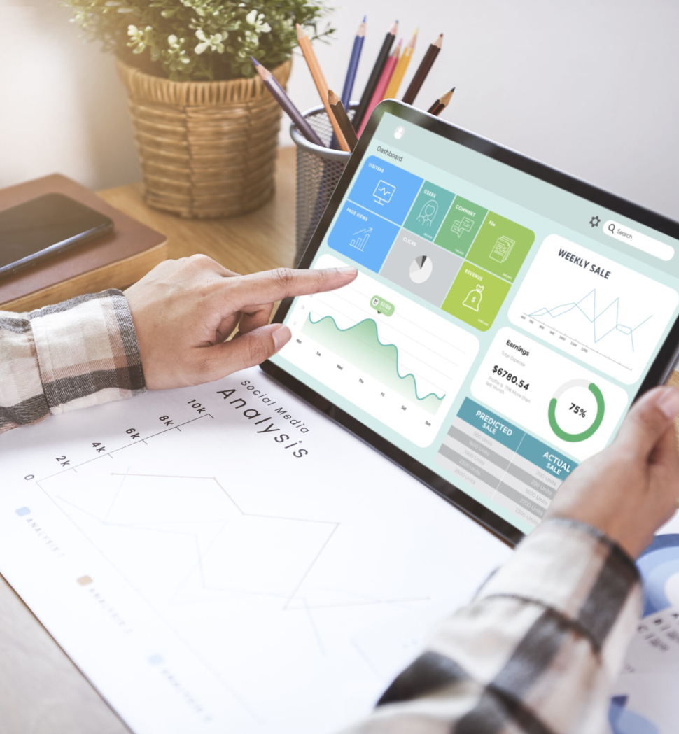 Businesswoman using a tablet to analysis graph company finance strategy statistics success concept and planning for future in office room.